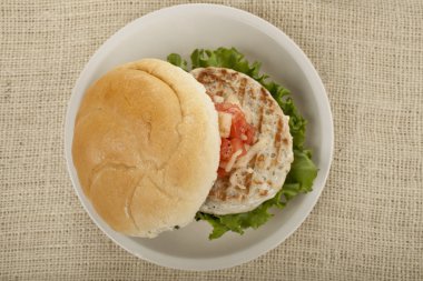 Plate of grilled chicken burger clipart