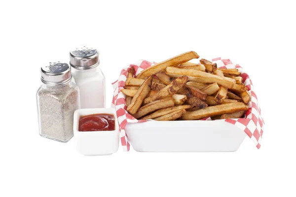 Uma tigela de batatas fritas com condimentos — Fotografia de Stock