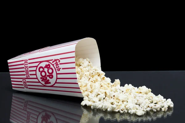 Bucket of spilled popcorn — Stock Photo, Image