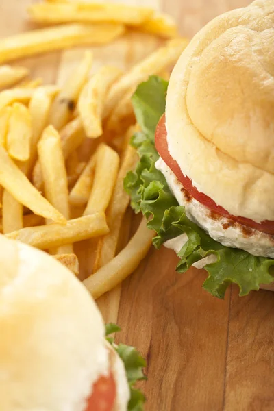 Hamburgers and potato fries — Stock Photo, Image