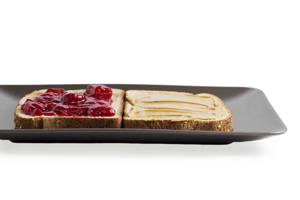 Honing en strawberry jam in een toast — Stockfoto