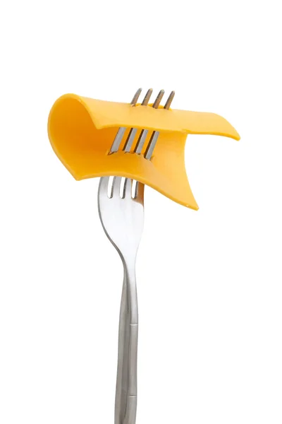 Slice of cheese in fork — Stock Photo, Image