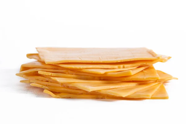 Slices of cheddar cheese — Stock Photo, Image