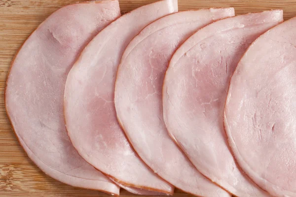 Slices of uncooked ham on the plate — Stock Photo, Image