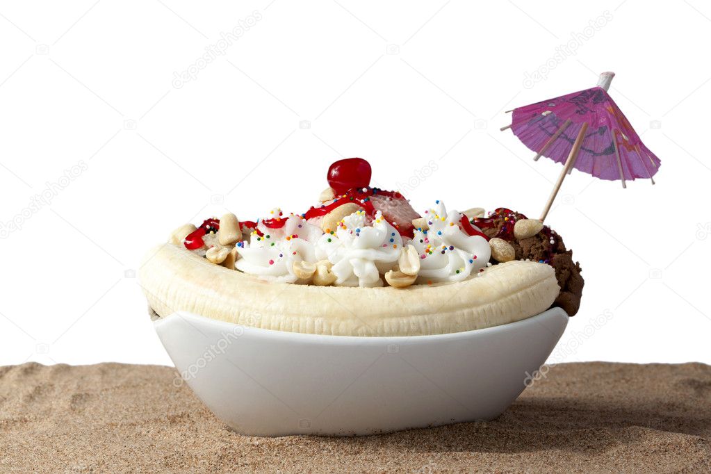 Bowl of banana split in sand