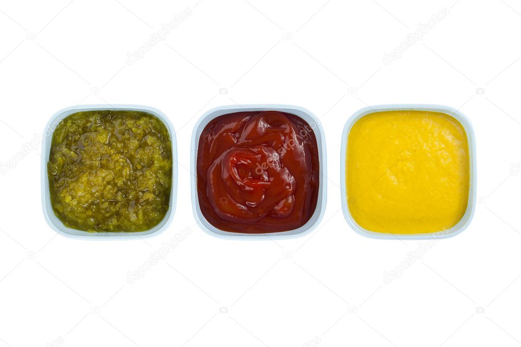 Ketchup mustard pickles on bowl