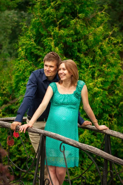 Happy young pregnant woman with young man — Stock Photo, Image