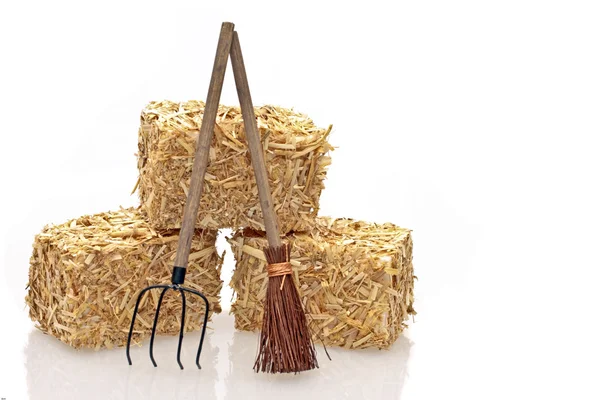 Hay bales with tools — Stock Photo, Image
