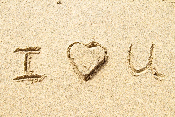 I love you write in sand — стоковое фото