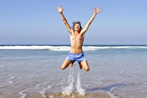 Happy guy jumping out of the water — Stock Photo, Image