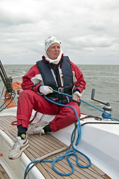 Sailor at work during sailing race in the Netherlands