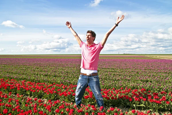 Happy guy in the tulip fields
