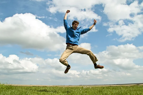 Happy guy jumping in the air — Stock Photo, Image