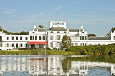 Medieval building Amstel hotel in the Netherlands clipart