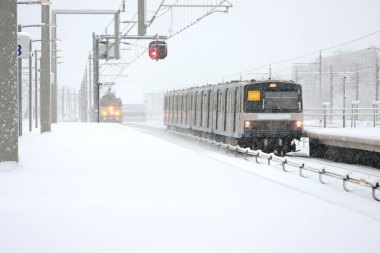 Trains driving in snowstorm at Bijlmerstation in Amsterdam the Netherlands clipart