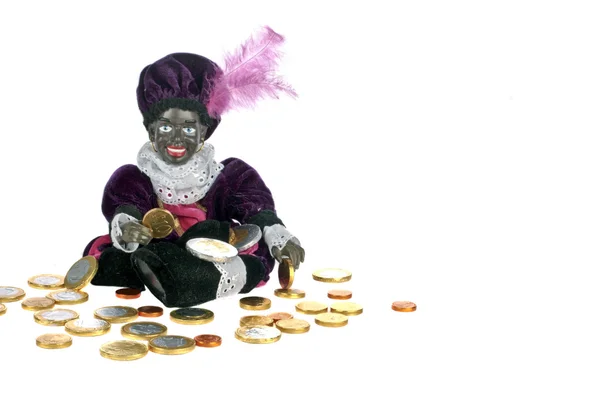Чорний Piet, сидячи на мішок з gingernuts і цукерок — стокове фото