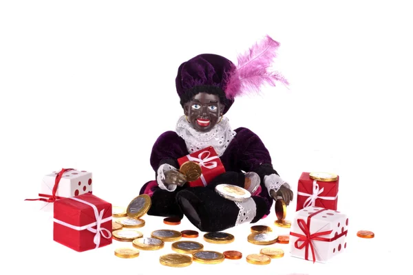 Zwarte Piet con regalos y dulces para la típica fiesta holandesa el 5 de diciembre —  Fotos de Stock