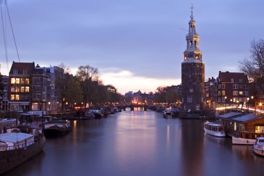 Amsterdam at night with the Munttower in the Netherlands clipart