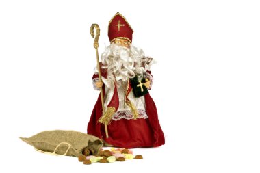 Traditional dutch culture: Santa Claus with a bag full of gingernuts and sweets at the 5th of december clipart