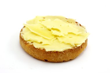 Cracker with butter and real dutch cheese, a typical dutch delicacy isolated on white