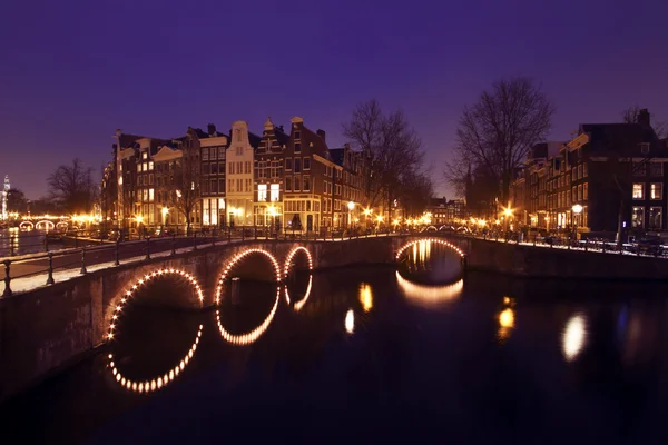 Thiny bridge by night in Amsterdam the Netherlands — Stock Photo, Image