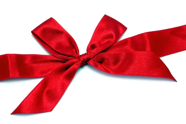 Red ribbon with bow isolated on white — Stock Photo, Image