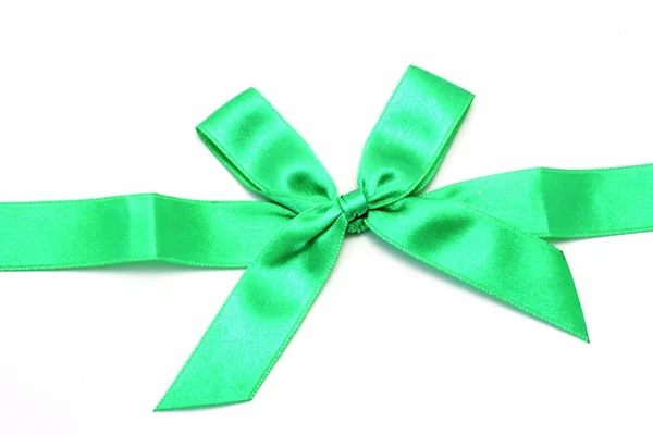 Green ribbon with bow isolated on white — Stock Photo, Image