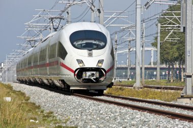 Fast speed train running in the countryside from the Netherlands clipart
