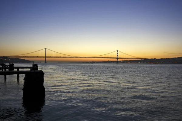 25 April bridge near Lisbon in Portugal at sunset — Stock Photo, Image