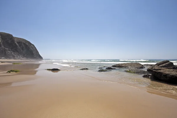 Rock in the ocean at Alvor in Portugal — Stock Photo, Image