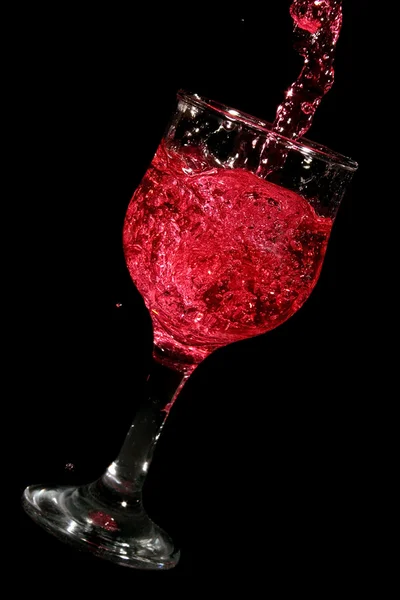 Red wine glass filling with wine — Stock Photo, Image