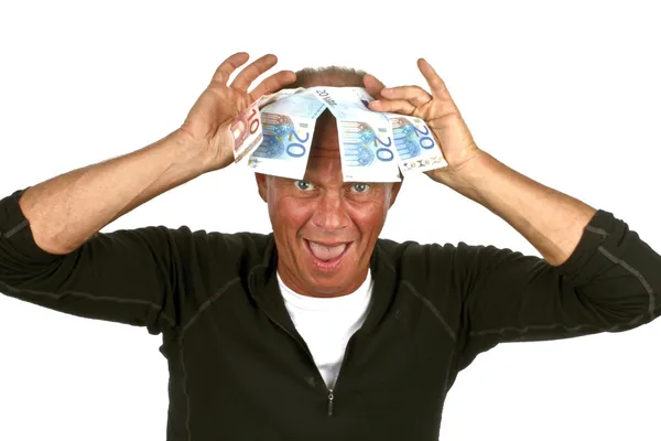 Άνθρωπος με αστείο πρόσωπο και τραπεζογραμμάτια που καλύπτει το κεφάλι του — Φωτογραφία Αρχείου