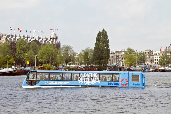 Floating bus is cruising through Amsterdam canals