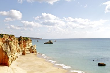 Rocky southcoast near Lagos in Portugal clipart