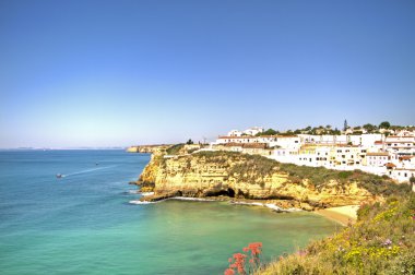 Carvoeiro at the Atlantic ocean in the Algarve Portugal clipart