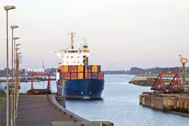 Cargo ship at IJmuiden harbor in the Netherlands clipart