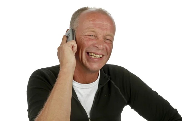 Homem risonho ao telefone — Fotografia de Stock