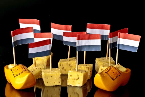 Dutch pickle cheese and clogs with dutch flags — Stock Photo, Image