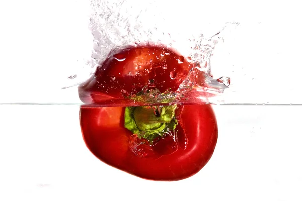 stock image Red pepper plunging in water