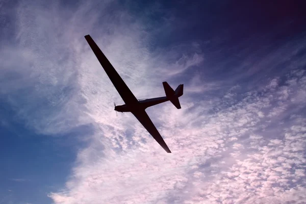 Glider against a beautiful sky at sunset — Stock Photo, Image