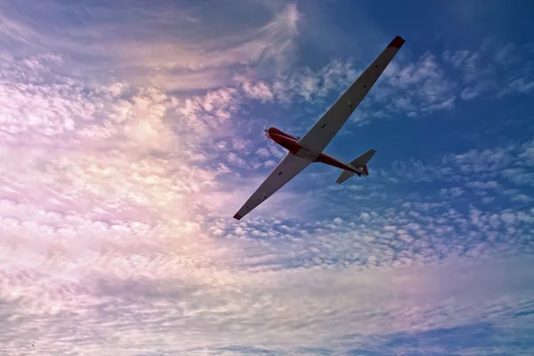 Glider against a beautiful sky at sunset — Stock Photo, Image