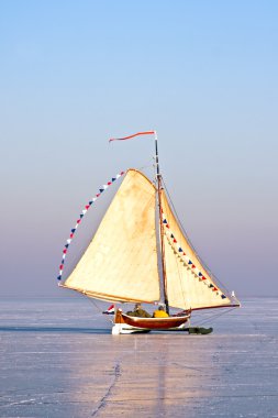 Ice sailing on the Gouwzee in the Netherlands in winter clipart