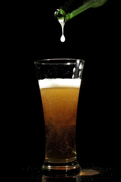 Beer pouring into a glass — Stock Photo, Image