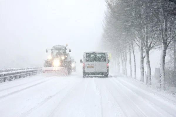 Snowplow driving in snowstorm in the Netherlands — Stock Photo, Image