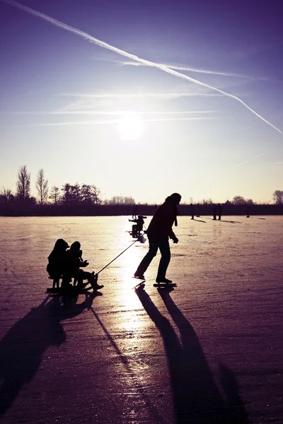 Ice skating at sunset in the Netherlands — Stock Photo, Image