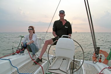 Sailing in the Netherlands at sunset clipart