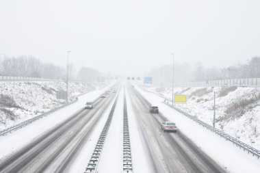 The famous A9 in a snowstorm in winter near Amsterdam the Nether clipart