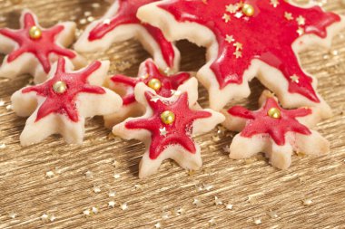 Christmas biscuits stars golden and red clipart