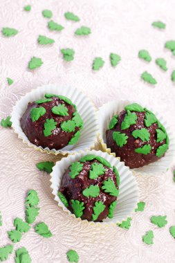 Chocolate pralines with christmas trees clipart