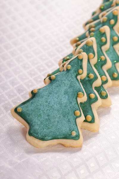 Karácsonyfa cookie-k꽃 초원에 말질감-카펫의 배경으로 사용할 수 있습니다 — 스톡 사진